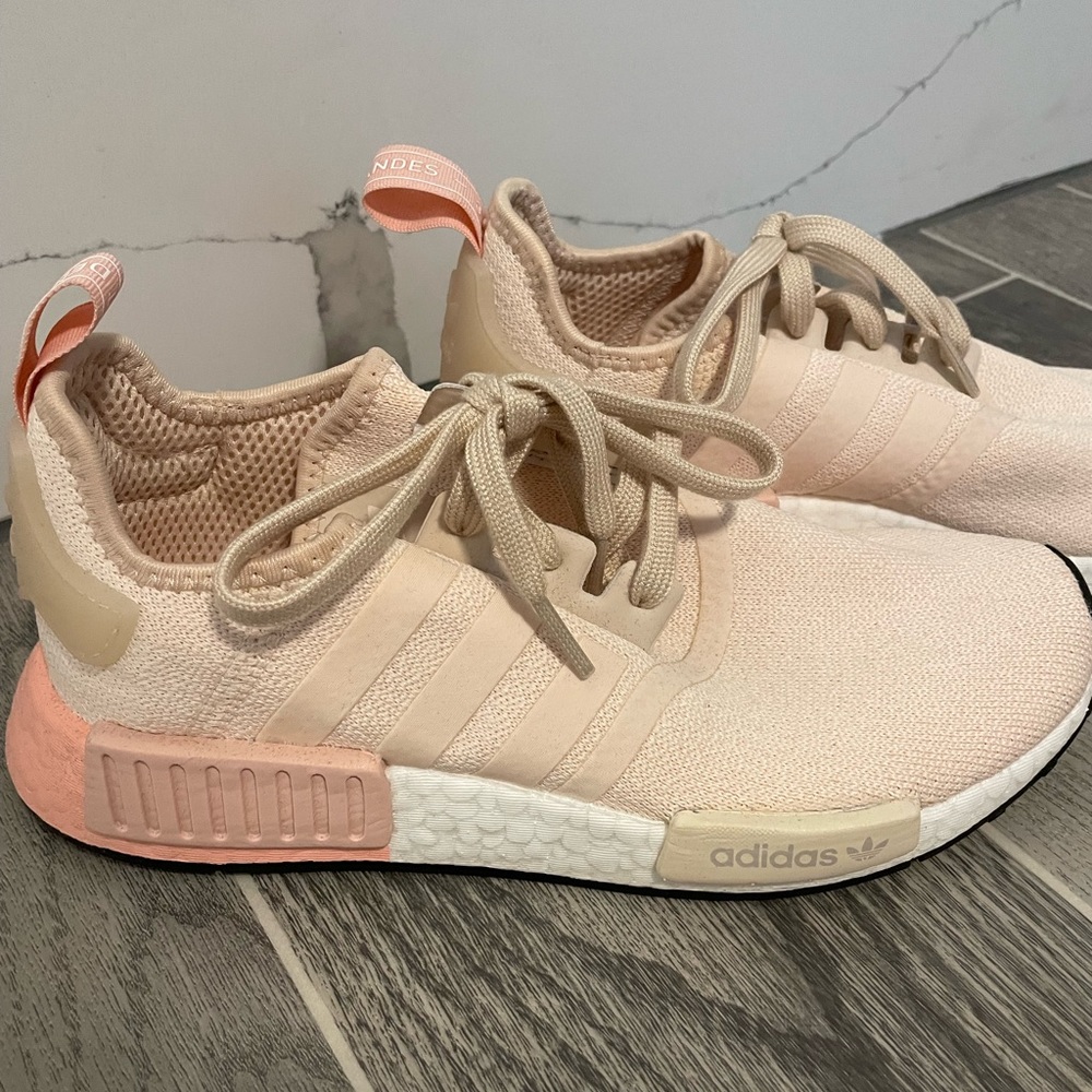 Peach adidas NMD tennis shoes